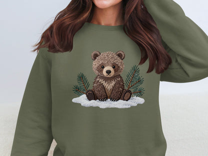 Cute Bear Sitting on Snow with Pine Tree Branches Top