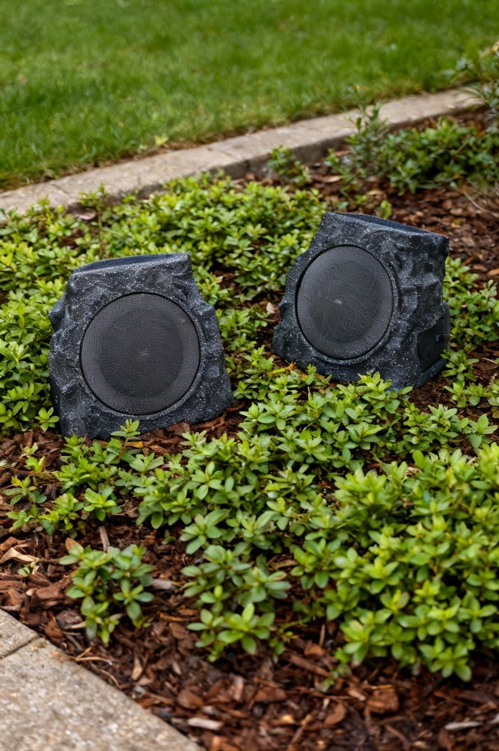 A solar powered rock speaker for a garden