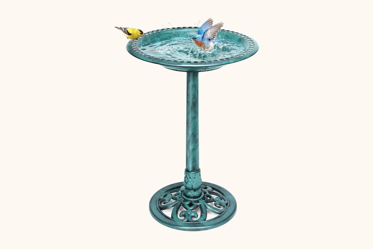 A 28 inch wide bowl pedestal bird bath