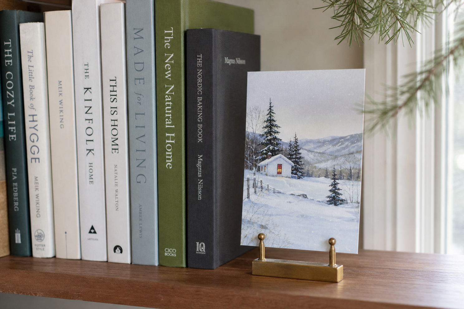 Holiday card in a stand beside books