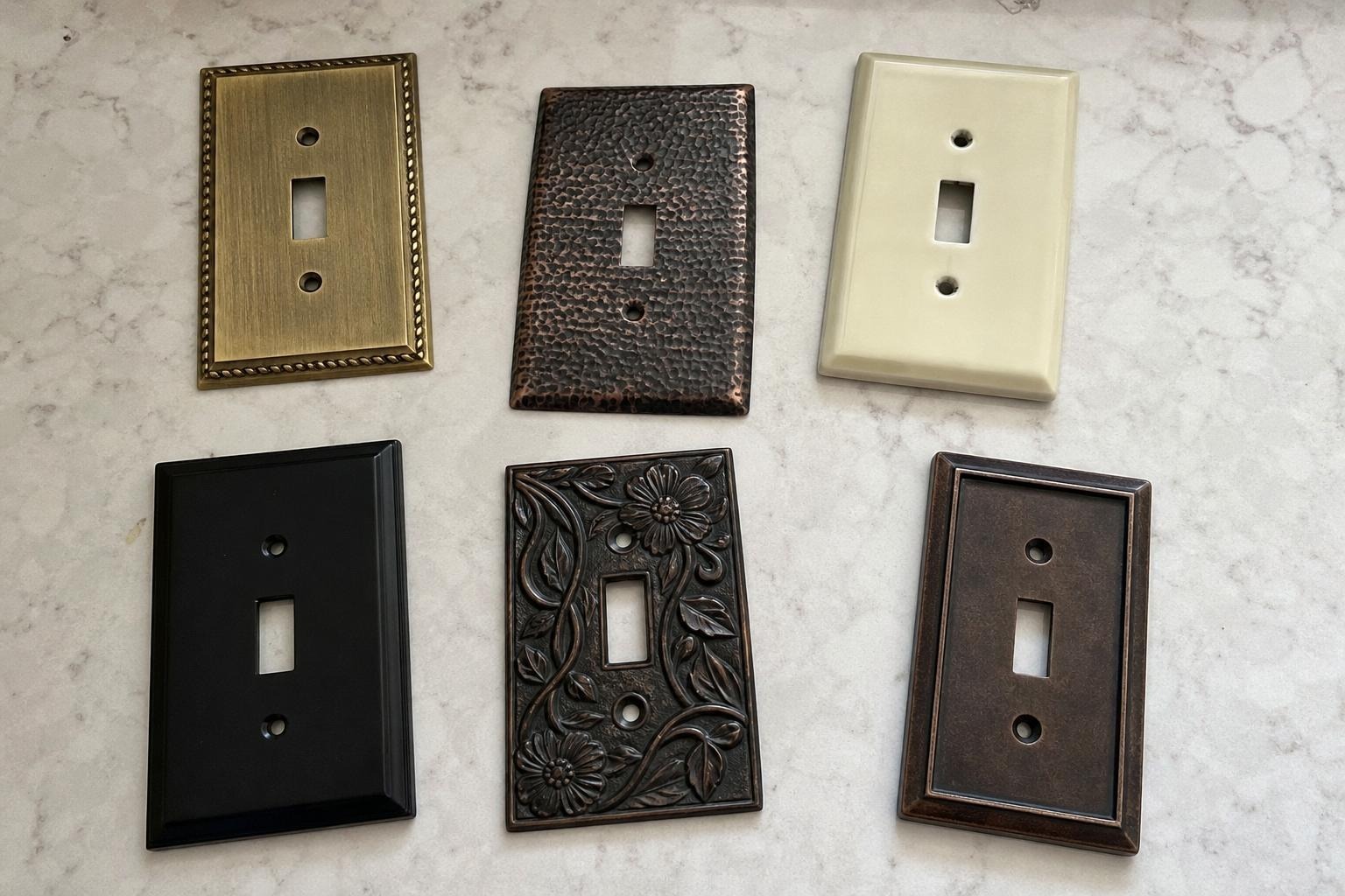 brass switch plate cover on a living room wall beside a doorway