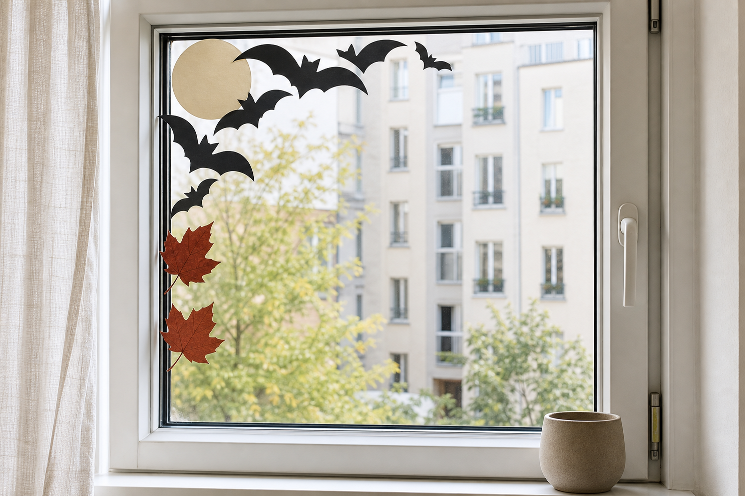 Asymmetrical matte paper Halloween border framing one corner of an apartment window