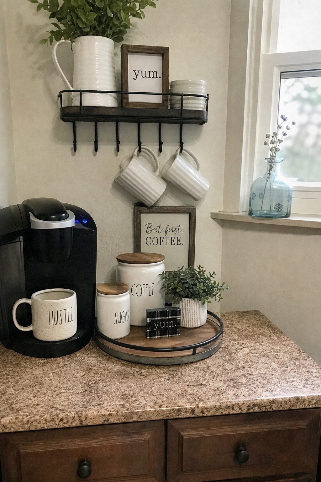 Clear glass canisters on a small riser holding dry pantry goods in an organized kitchen corner