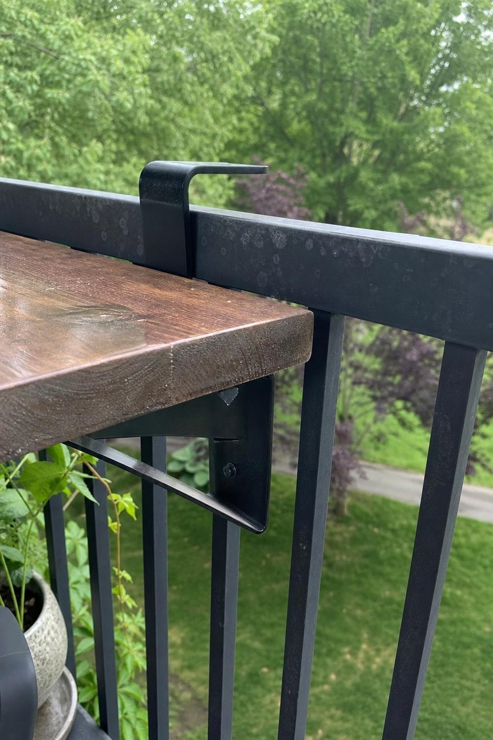 Acacia wood counter top and powder-coated steel stool frame on a small balcony