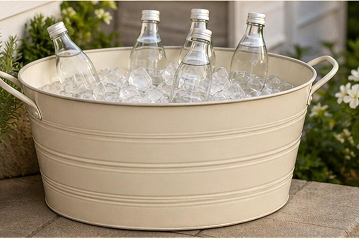 Vanilla-white galvanized beverage tub holding ice and unbranded bottles